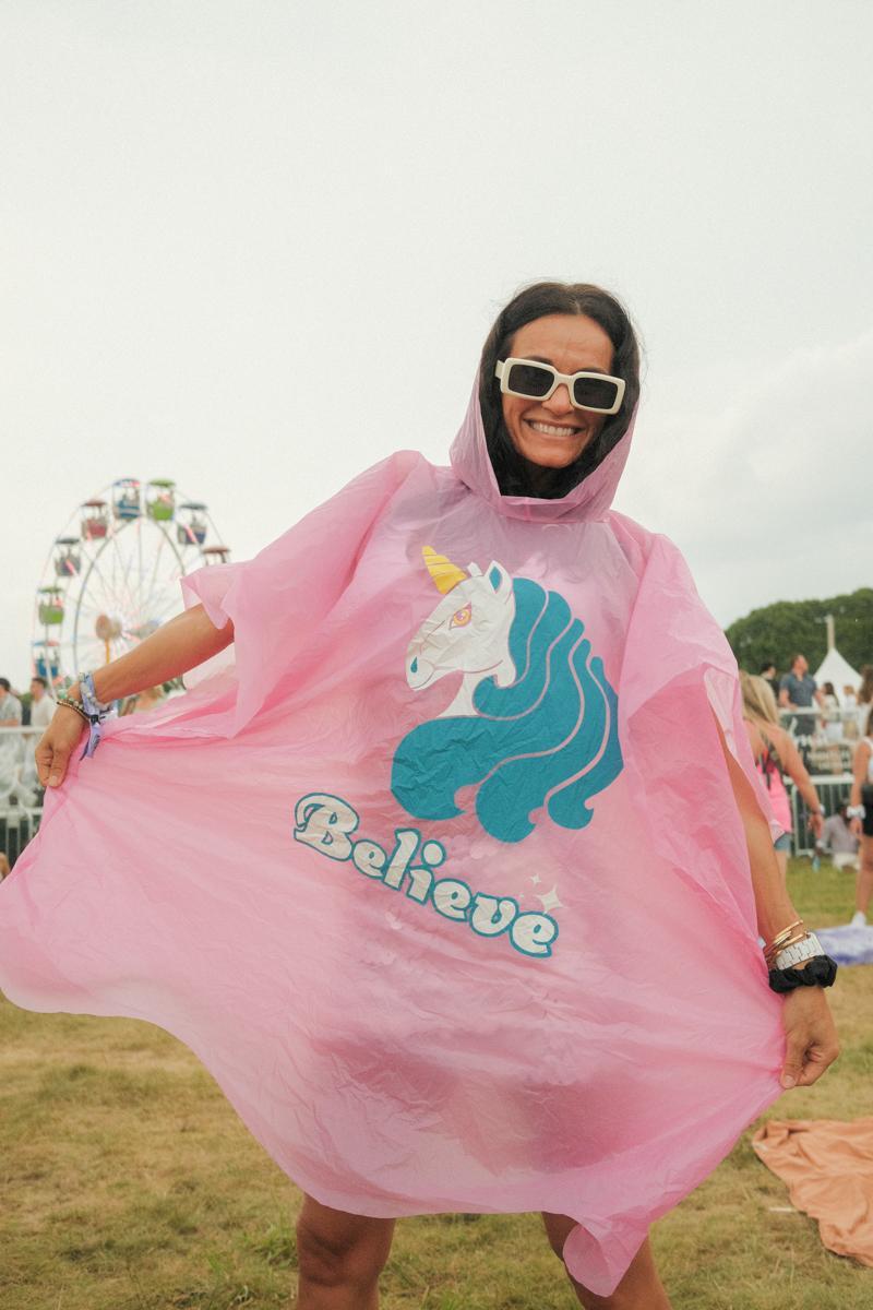 Woman brings a poncho for the rain for the Palm Tree Festival