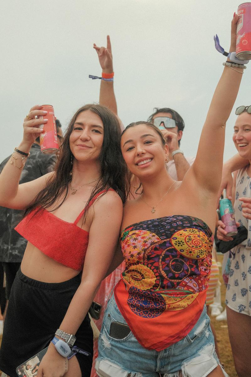 Two girls posing for a picture at the Palm Tree Festival